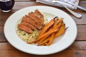 Thick-Cut Porterhouse Chipotle Steak with Roasted Baby Carrots & Minted Israeli Couscous