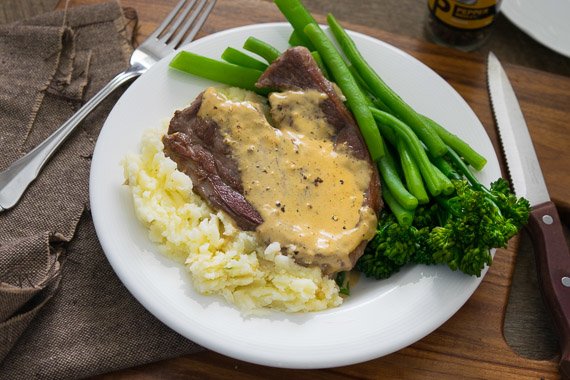 Steak with Creamy Pepper Sauce, Potato Mash & Greens