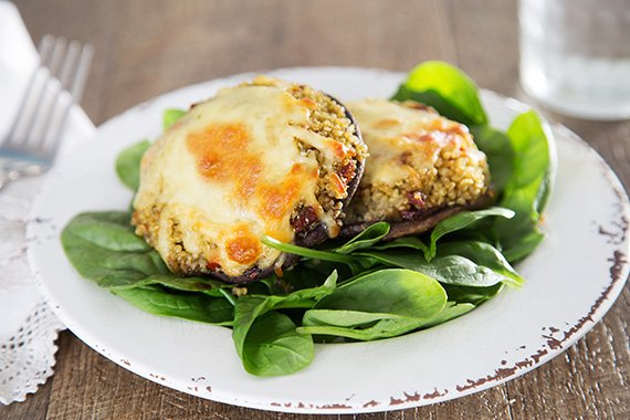 Cheesy Quinoa & Sundried Tomato Stuffed Portobello Mushrooms with Baby Spinach