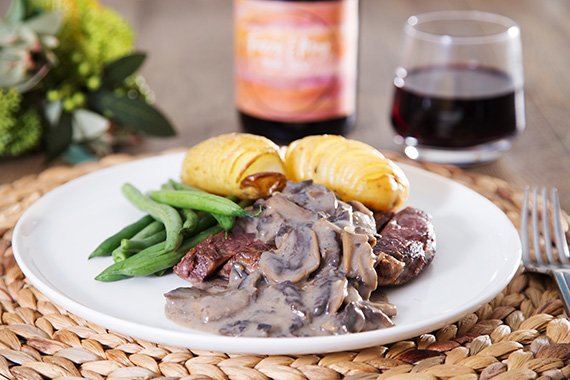 Steaks with Creamy Mushroom Sauce Hasselback Potatoes & Buttered Beans