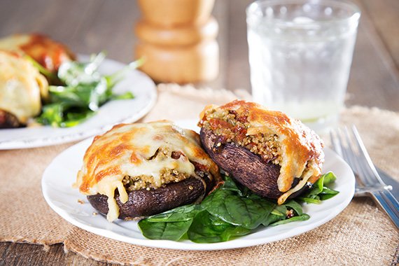 Portobello Mushrooms Stuffed with Cheesy Quinoa & Sundried Tomato served with Baby Spinach