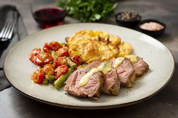 Dijon and Herb Crusted Mini Lamb Roast with Smashed Potatoes, Green Beans and Cherry Tomatoes