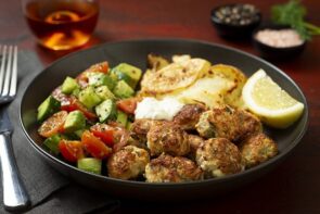 Spicy Chicken Ferra Meatballs with Smashed Potatoes Chopped Salad and Tzatziki