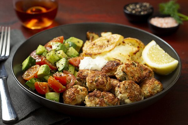 Spicy Chicken Ferra Meatballs with Smashed Potatoes Chopped Salad and Tzatziki