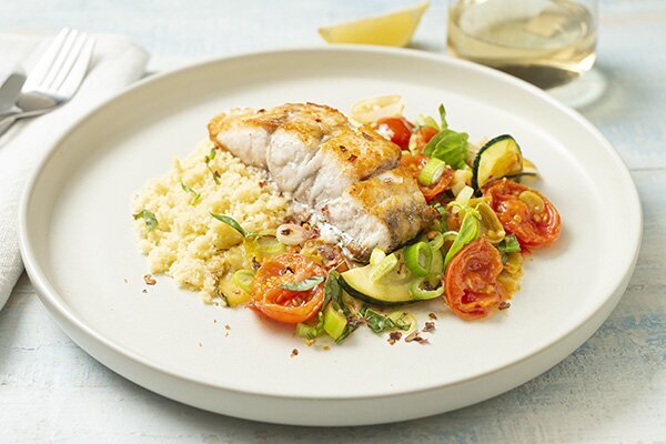 Crispy Barramundi and Couscous with Tomato and Zucchini in Lemon Butter