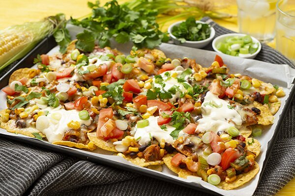 Loaded Veggie Nachos with Sour Cream and Jalapenos