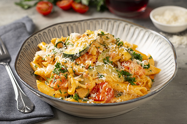 Penne Pasta with Zucchini and Bacon With Rosé Cream Sauce, Pine Nuts and Parmesan