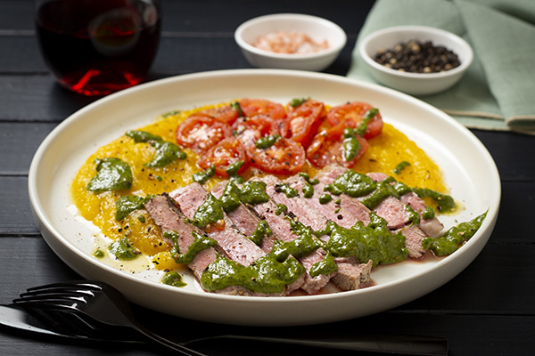 Porterhouse Steak with Spinach Chimichurri Pumpkin Potato Mash and Cherry Tomatoes