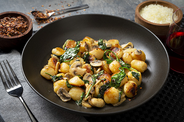 Pan Fried Gnocchi with Mushroom and Spinach in a Cream Sauce