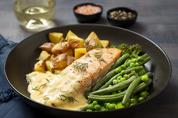 Salmon with Lemon and Dill Sauce, Roast Potatoes and Green Veg