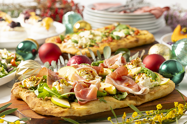 Handcrafted Italian Prosciutto Pinsa, with Creamy Lemon Ricotta, Fresh Pear and Hot Honey Drizzle