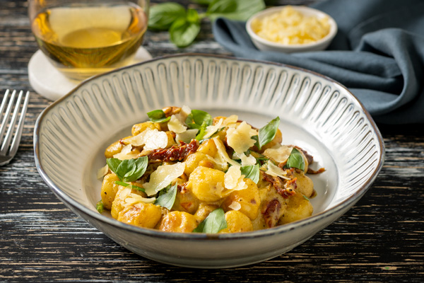 Creamy Pesto and Sun Dried Tomato Gnocchi With Toasted Pine Nuts, Fresh Basil and Parmesan