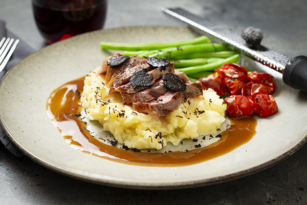 Grass Fed Porterhouse with Black Truffle Mash, Almond Beans and Red Wine Jus
