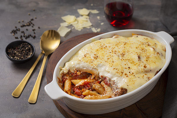 Beef and Tomato Pasta Bake Topped with Creamy Bechamel Sauce